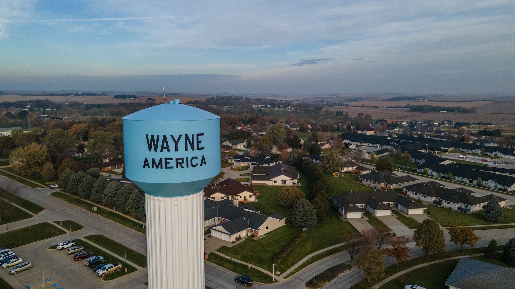 Wayne America Water tower, with homes dotted in the background.